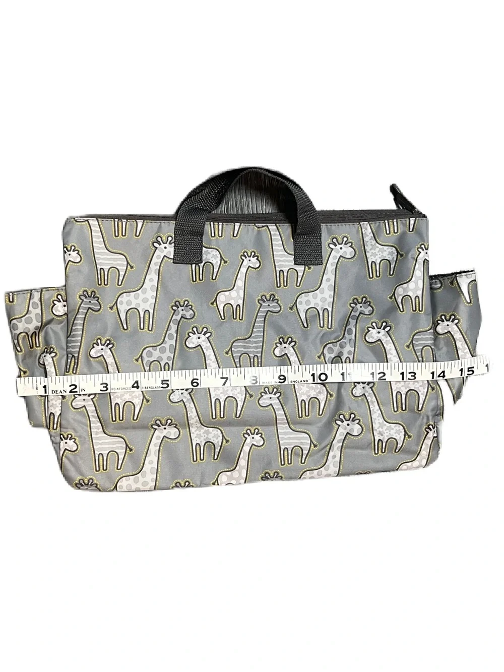 Thirty-One Zip-Top Tote in the Go Go Giraffe print with seven pockets